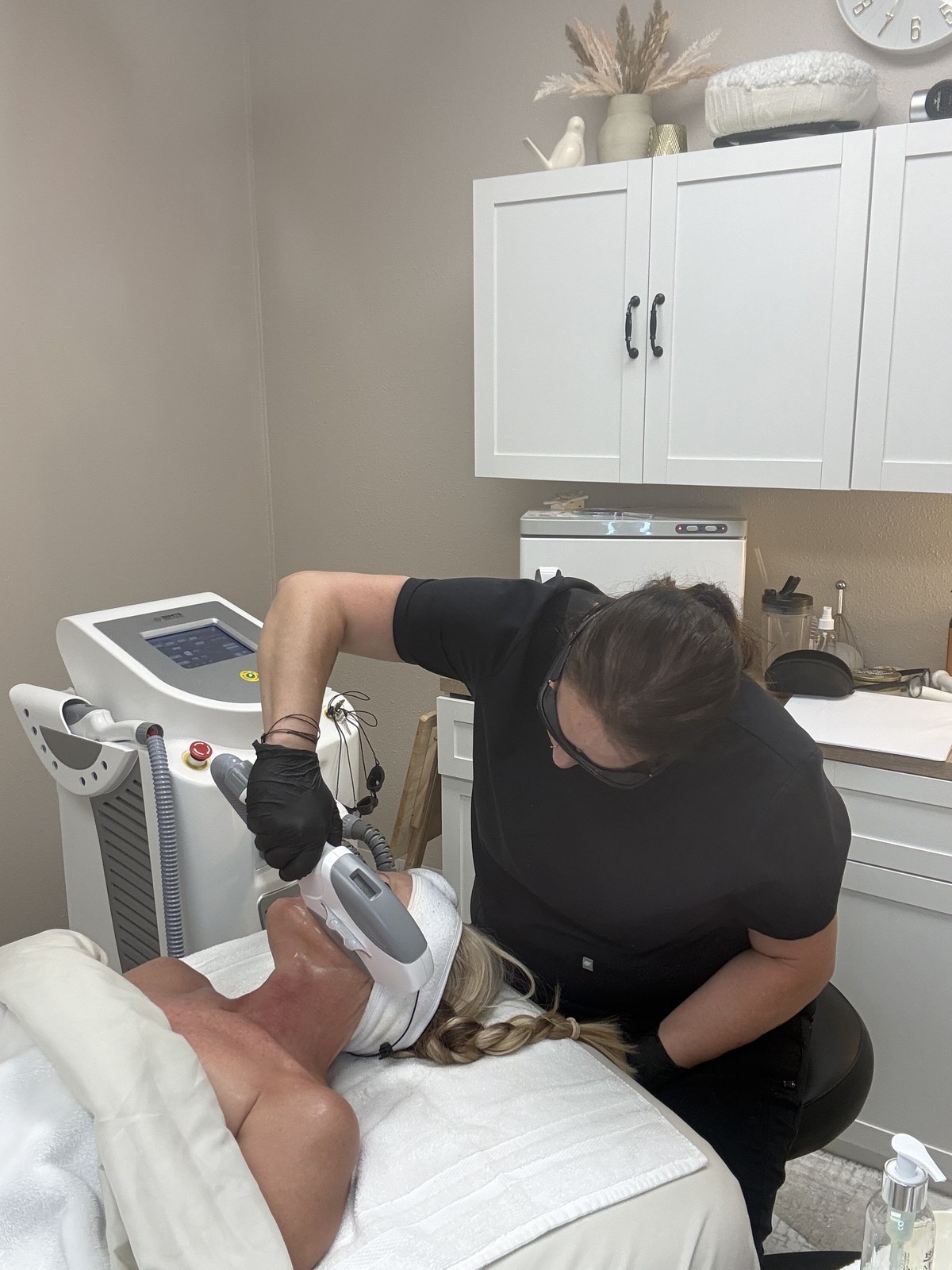 Amy performing an IPL skin rejuvenation treatment