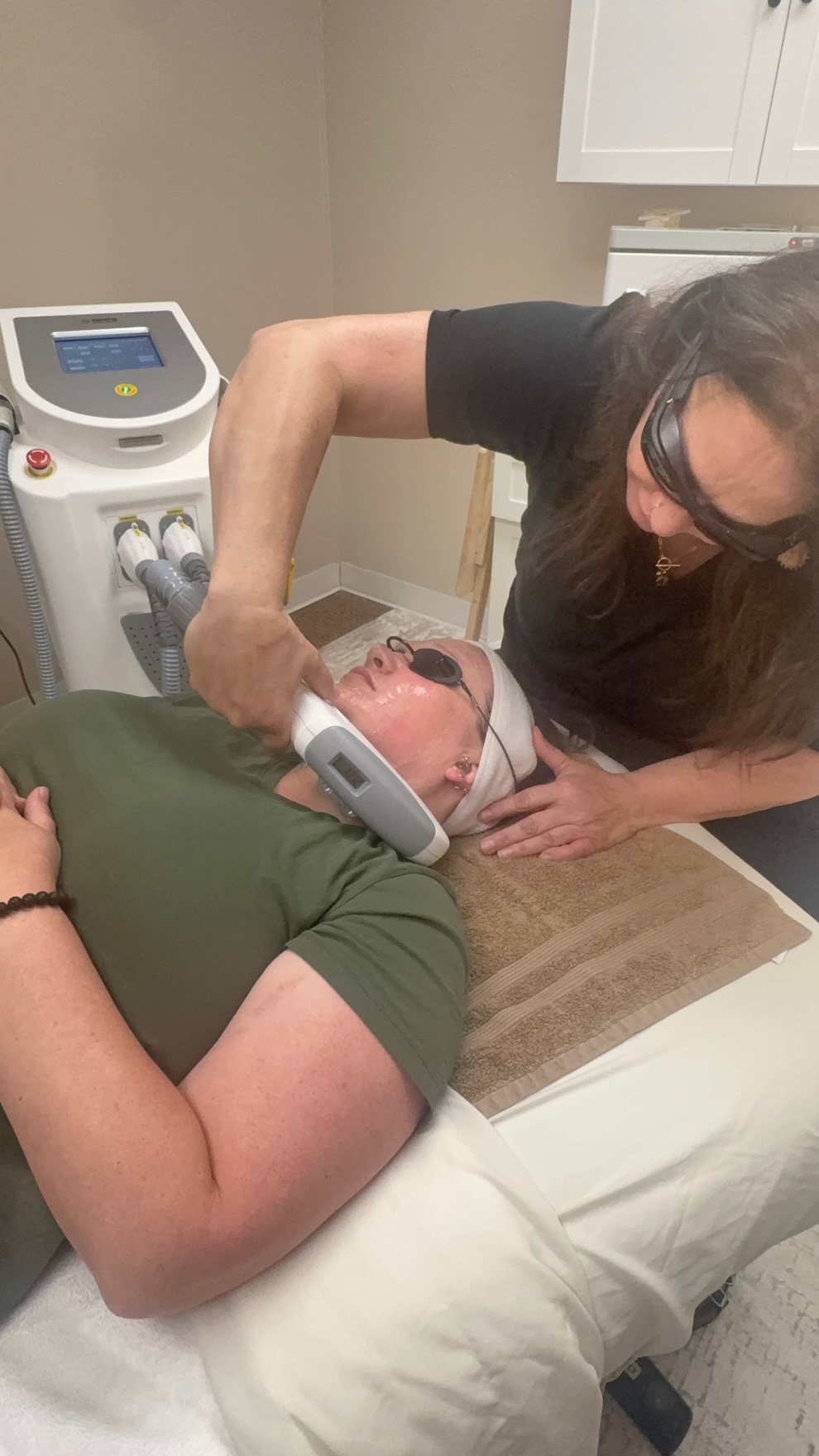 Amy performing an IPL skin rejuvenation treatment